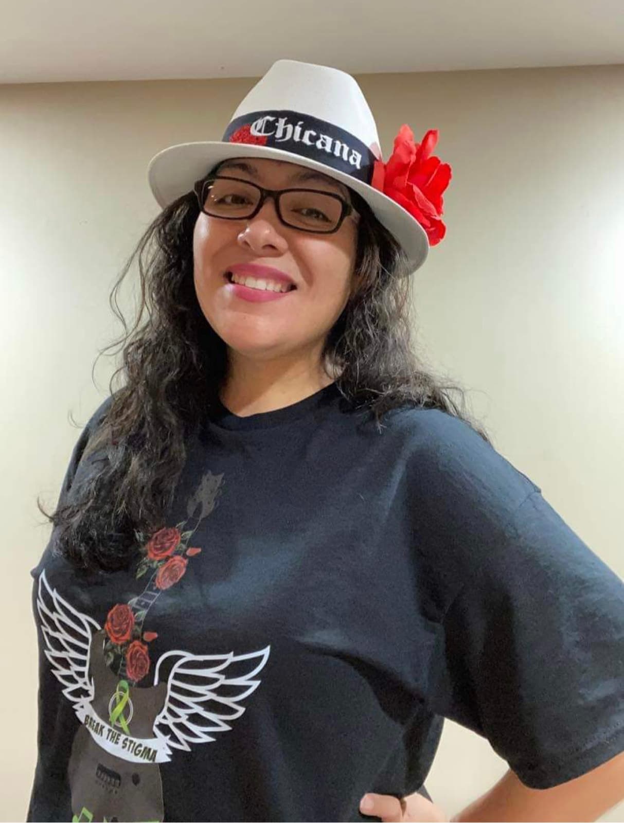A supporter wearing the winged-guitar tee